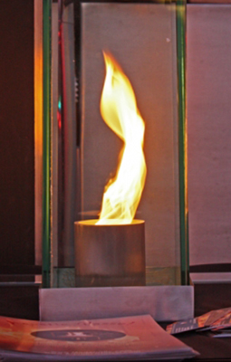 Swirling fire in glass outdoor feature